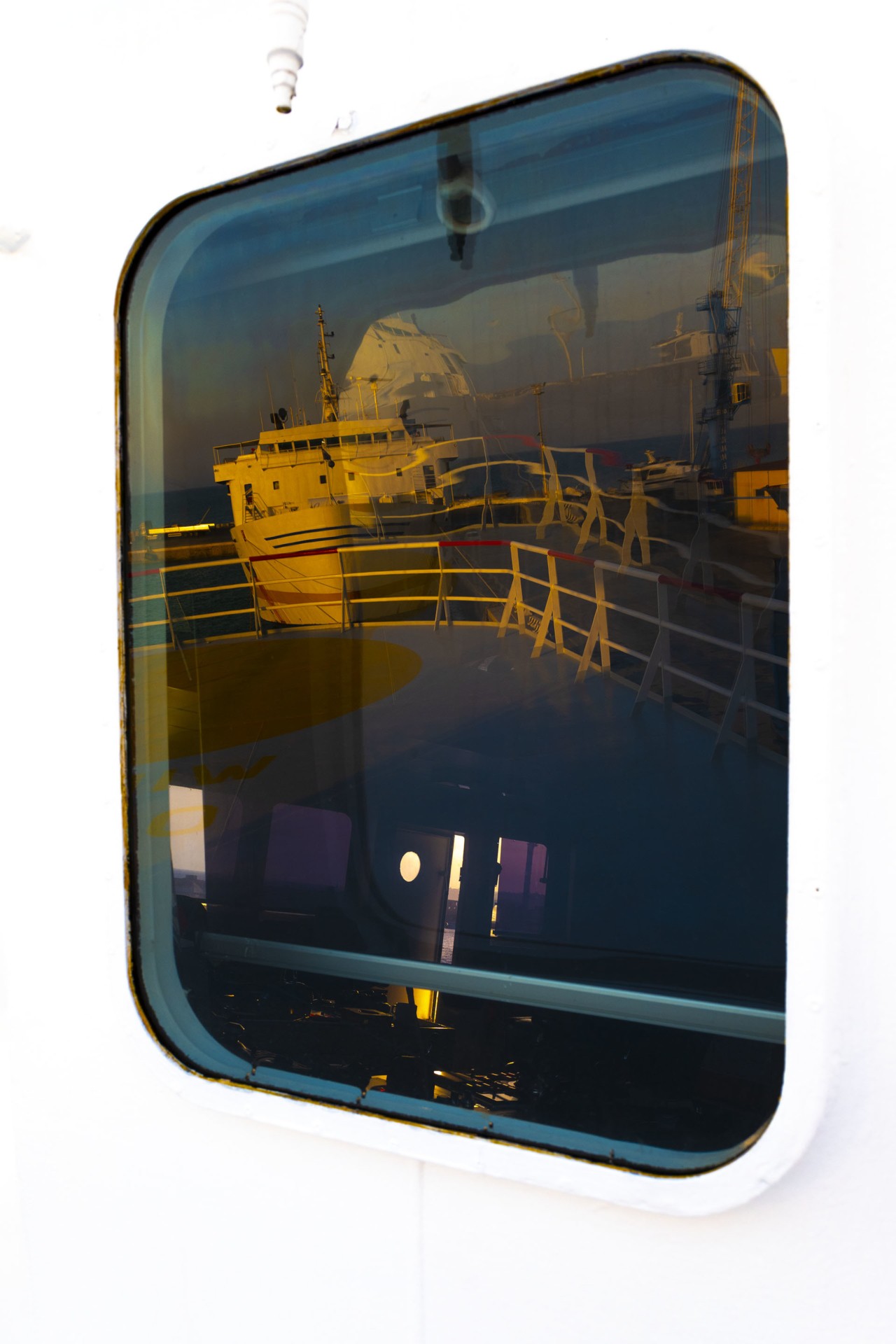 Ship window relfection Blue cargo shipment by Alessia Rollo